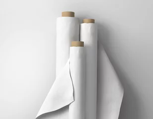 Rolgordijnen Three large blank white empty plain fabric bolts standing against white isolated background © PIXPINE