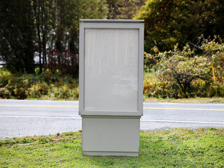White blank outdoor vertical advertising signage on a roadside in day time