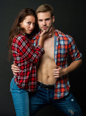 sexy young couple in love embrace on black background, relationship