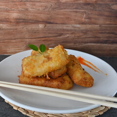 Selective focus risoles sosis mayo (American risoles) or mayonnaise sausage rissole is a small patty rolled in breadcrumbs. it is filled with mayonnaise, boiled egg and sausage.