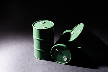 green oil tin barrels on black background