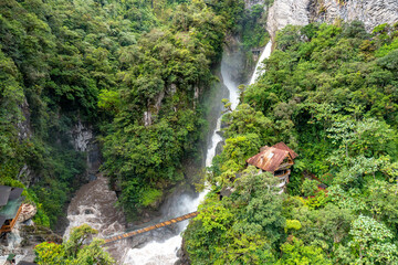Fototapeta na wymiar El Pailon del Diablo waterfall cascade and suspended bridge. Aerial view. Banos Santa Agua, Ecuador. South America.