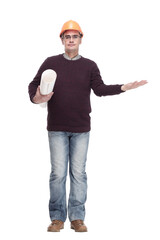 man in a protective helmet with drawings of a new project