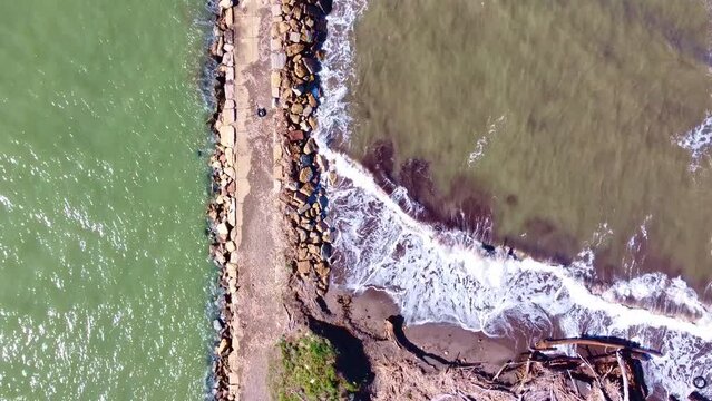 Aerial view of the pier at the mouth of Fiora river in Montalto di Castro, Lazio
