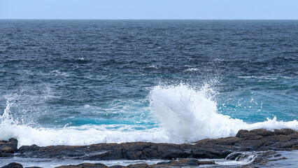waves crashing on the rocks