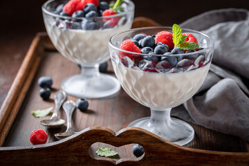 Sweet and traditional Panna Cotta with berries mousse.