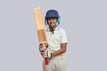 Portrait of boy wearing cricket Helmet and holding Bat - Powered by Adobe