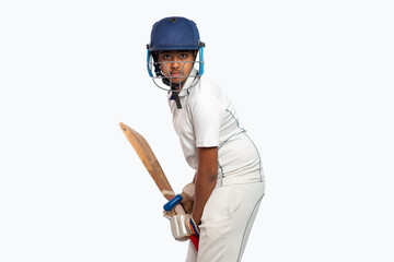 Portrait of boy getting ready to strike During a Cricket Game