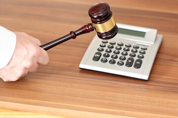 auction symbol with calculator and gavel on background - 501861495