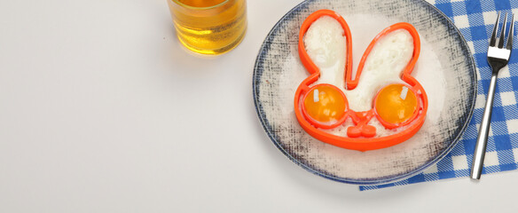 Sunny-side-up eggs for kids on colourfull background.