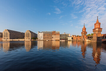 cityscape view of Berlin Kreuzberg  as seen from across the river Spree, with the Oberbaum Brücke...