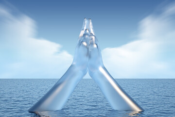 ice sculpture of gesture of praying hands in the sea