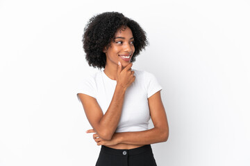 Young African American woman isolated on white background looking to the side and smiling