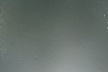 wet glass background condensate / abstract rain, drops texture on transparent glass