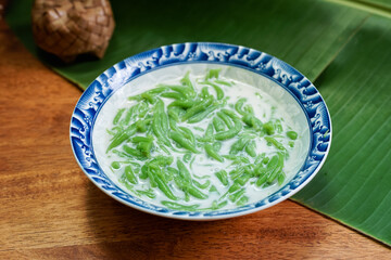 Lod Chong, Thai dessert, Lod Chong with coconut milk on a wooden floor.
