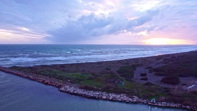 Aerial view of the pier at the mouth of Fiora river in Montalto di Castro, Lazio