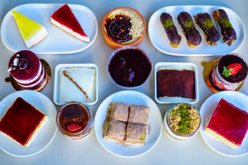 Table scene of assorted take out or delivery foods. Traditional Turkish cuisine. Various Turkish desert and cake. Top down view on a table.