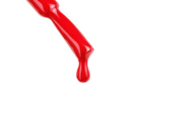 Red nail polish brush with drop isolated on white