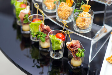 various cold appetizers with lettuce on the buffet close-up