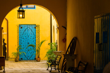 Traditional colorful Cuban architecture. Blue door facade and porch of a building. Architectural...