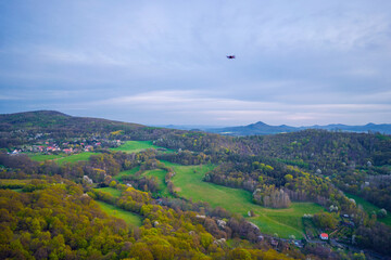 Drone flying during the day in the mountains during sunset or sunrise. Shooting travel content on a drone.