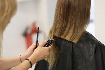 Process of hair cutting at beauty salon, using hair clipper
