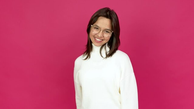 Young brunette woman with glasses and happy