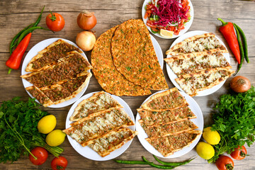 Traditional Turkish cuisine. Pizza, pita, pidesi, sucuk, hummus, kebab. Many dishes on the table. Serving dishes in restaurant. Background image. Top view, flat lay