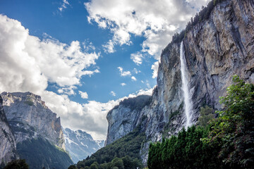 Staubbach waterfall in Lauterbrunnen village in Bernese Alps Switzerland - 501880473