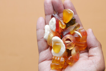 close up of gummy candy on hand 