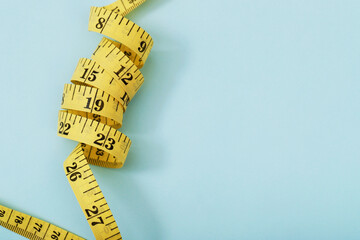 tape measure for obese people on a blue background