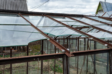 Fototapeta premium broken greenhouse with glass windows