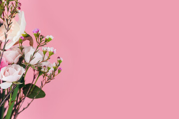 Fototapeta na wymiar floral background: beautiful bouquet on a pink background, copy space