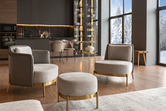 chic modern design of a dark expensive interior of a luxurious country house with huge panoramic windows and a magnificent view of the divine forest