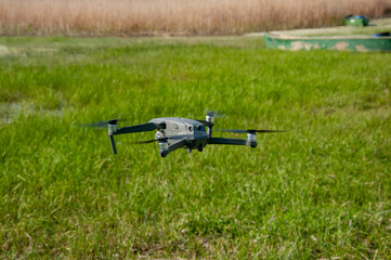 Opposite view of drone shooting over green field.
