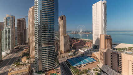 Panoramic view of the Dubai Marina and JBR area and the famous Ferris Wheel aerial timelapse