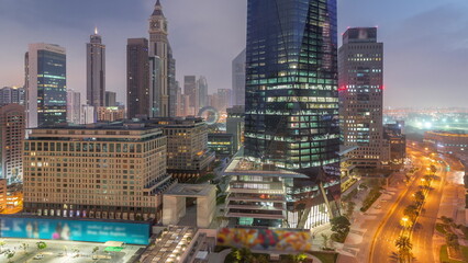 Dubai International Financial district aerial night to day timelapse. View of business office...
