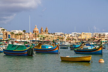 Fototapeta na wymiar Boats in the harbor of Marsaxlokk