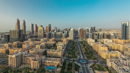 Panorama showing skyscrapers in Barsha Heights district and low rise buildings in Greens district aerial timelapse. Dubai skyline