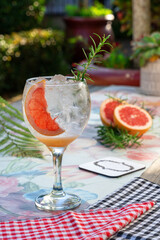 grapefruit cocktail in a tall glass