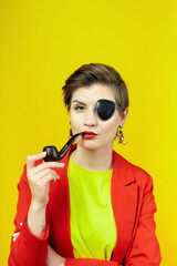 A woman with a pirate patch over one eye smokes a pipe. A sly expression on his face. Short...