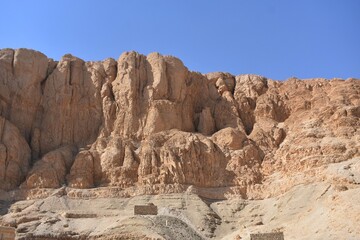 Fototapeta na wymiar Barren rocks and mountain, at the Mortuary Temple of Queen Hatshepsut in Luxor, Egypt.
