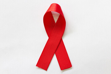 Red ribbon, red May. Awareness campaign on the prevention of oral cancer. - obrazy, fototapety, plakaty