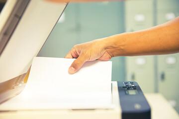 Copier printer, Close up hand office man put and scanning paper on panel to using the copier or...