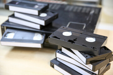 Pile of video cassette tape VHS with video playback old retro style stack concept of vintage...