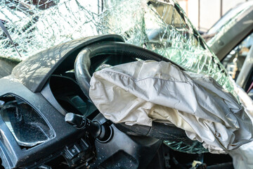 car after a car accident at a junkyard, airbag