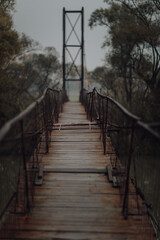 Vertical shot of old wooden bridge