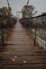 Vertical shot of old wooden bridge