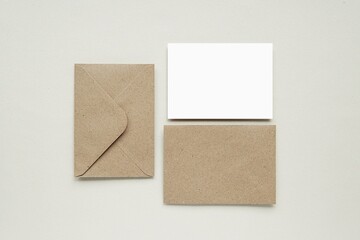 Set of brown kraft paper envelope and card mockup for design, text, address label presentation. 