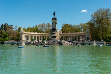 Fototapeta na wymiar Madrid, Spain - April 16, 2022: Retiro pond, monument to Alfonso XII